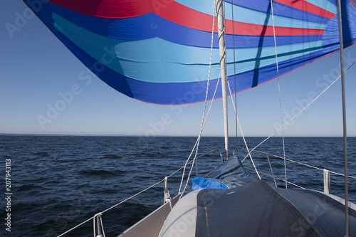 Flying a colorful spinnaker...