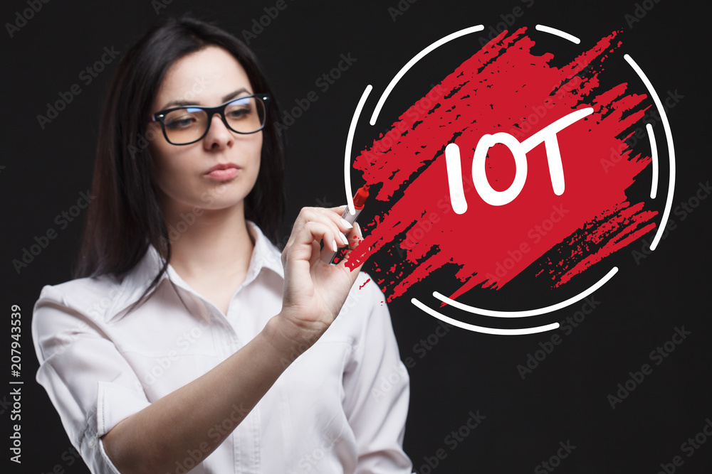 The concept of marketing, technology, the Internet and the network. A young businessman shows what is important for business: IOT The concept of marketing, technology, the Internet and the network. A young businessman shows what is important for business: IOT