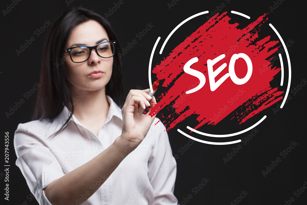 The concept of marketing, technology, the Internet and the network. A young businessman shows what is important for business: SEO The concept of marketing, technology, the Internet and the network. A young businessman shows what is important for business: SEO