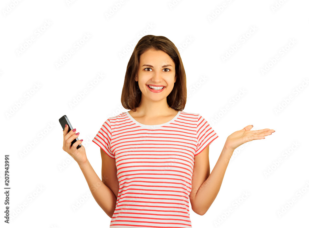 Portrait of a smiling young woman who spread her arms to the side while holding a mobile phone. emotional girl isolated on white background Portrait of a smiling young woman who spread her arms to the side while holding a mobile phone. emotional girl isolated on white background