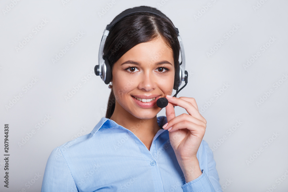 customer support phone operator in headset, with blank copyspace area for slogan or text message, over grey background. Consulting and assistance service call center. customer support phone operator in headset, with blank copyspace area for slogan or text message, over grey background. Consulting and assistance service call center.