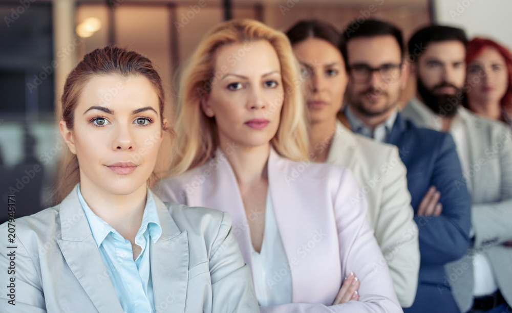 Successful business people looking at camera Successful business people looking at camera