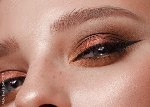 Obraz Closeup shot of female eye with color eyes shadows and eyelashes makeup