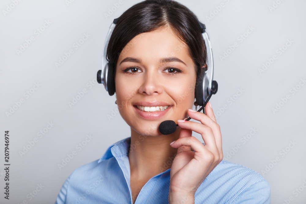 customer support phone operator in headset, with blank copyspace area for slogan or text message, over grey background. Consulting and assistance service call center. customer support phone operator in headset, with blank copyspace area for slogan or text message, over grey background. Consulting and assistance service call center.