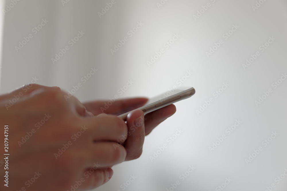 Man looking to smartphone in his hands. Man looking to smartphone in his hands.