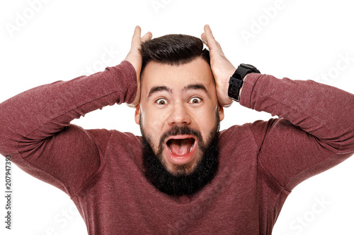 bearded football fan in cap celebrating.