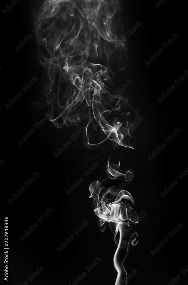 abstract beautiful fragment movement of burn white smoke on black background.