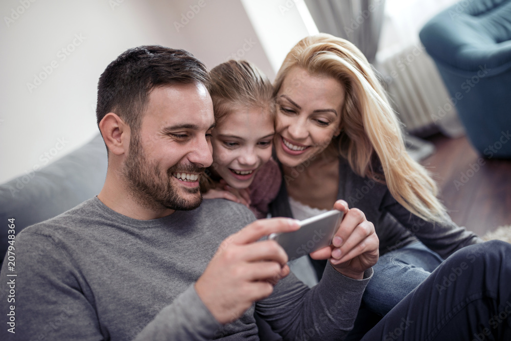 Happy family taking selfie in their house Happy family taking selfie in their house