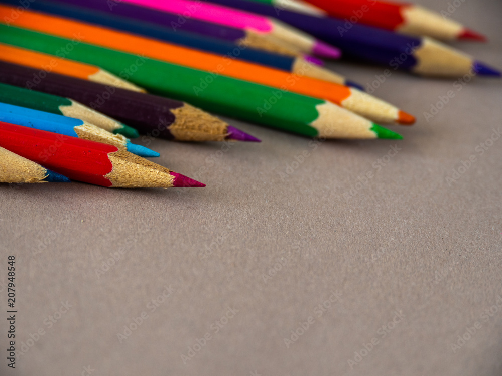 Colored pencils on a light brown background. Colored pencils on a light brown background.