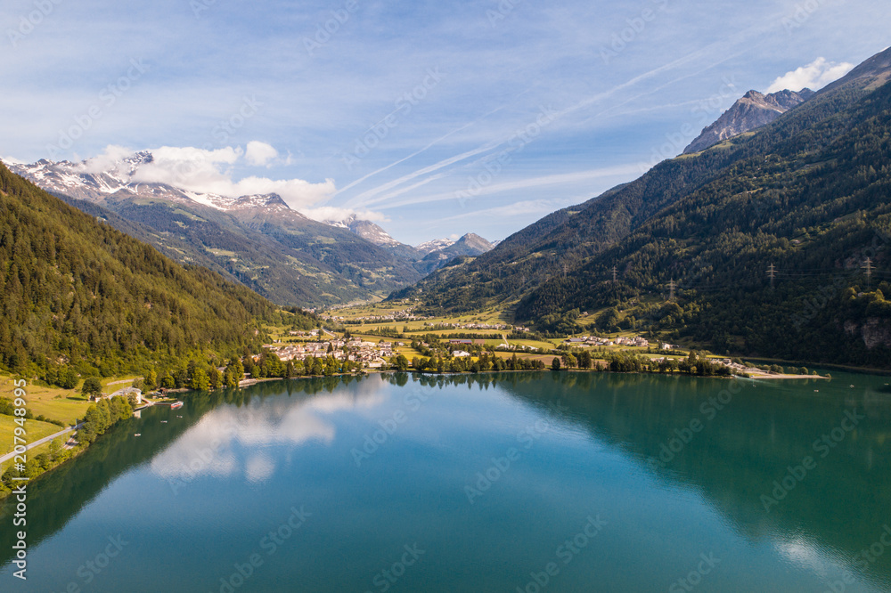 Swiss Alps, lake and village of Poschiavo. Aerial shot. 