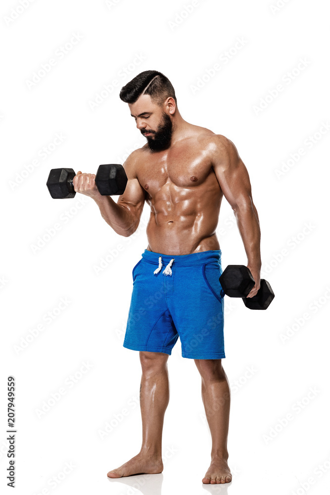 muscular man doing exercises with dumbbells. muscular man doing exercises with dumbbells.