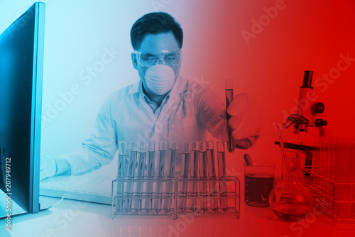 scientist checking sample cemical in  test tube at working table , science research concept photo