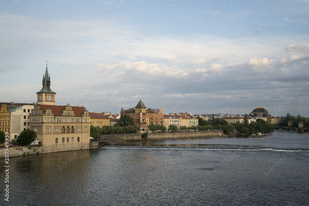 A panoramic view of Moldava river in the center of the city at sunset in Prague, Czeche Republic