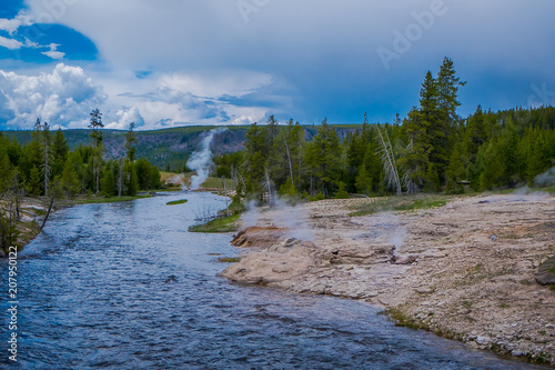 Gorgeous outdoor view of firehole river in the Yellowstone national park photo