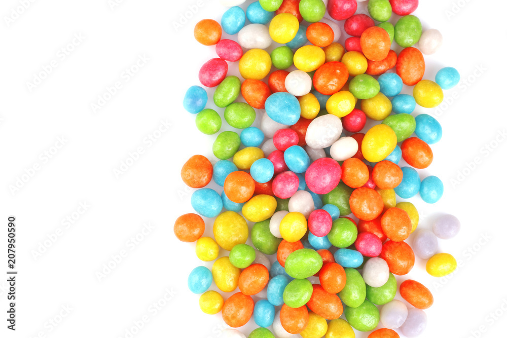 Obraz premium Multicolored round candy on a white background. Top view. Isolated.