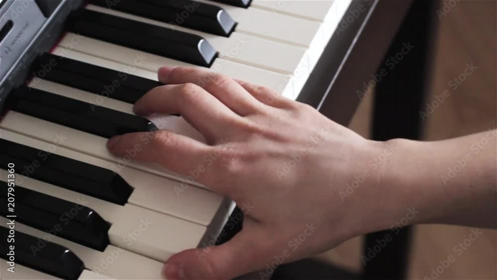 Play piano. Close up of female hands playing the piano. Fingers on the piano, vintage colors. A very close look at a jazz pianist's hands. Woman playing the piano, close-up. Play piano. Close up of female hands playing the piano. Fingers on the piano, vintage colors. A very close look at a jazz pianist's hands. Woman playing the piano, close-up.