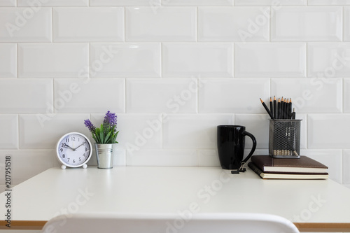 White desk table with copy space, supplies and coffee mug. Front view workspace and copy space