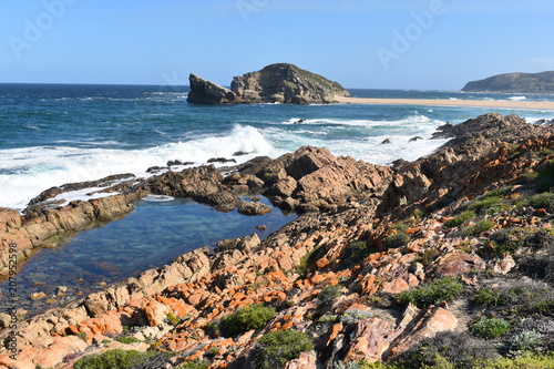 Wonderful landscape with the blue beach at the hiking trail at Robberg Nature Reserve in Plettenberg Bay, South Africa photo