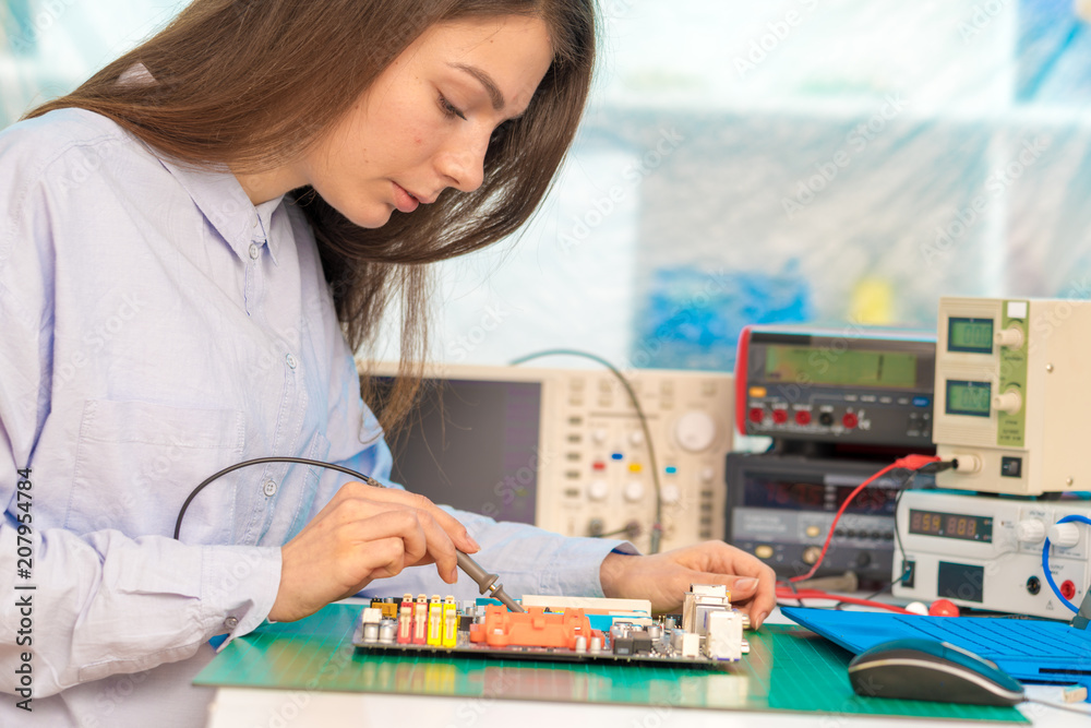 Fototapeta premium girl student in the class physics and electronics
