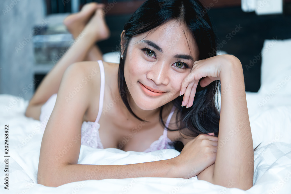 Portrait Asian sexy woman in the bed,Perfect portrait Thailand lady indoors,make sexy eyes Portrait Asian sexy woman in the bed,Perfect portrait Thailand lady indoors,make sexy eyes