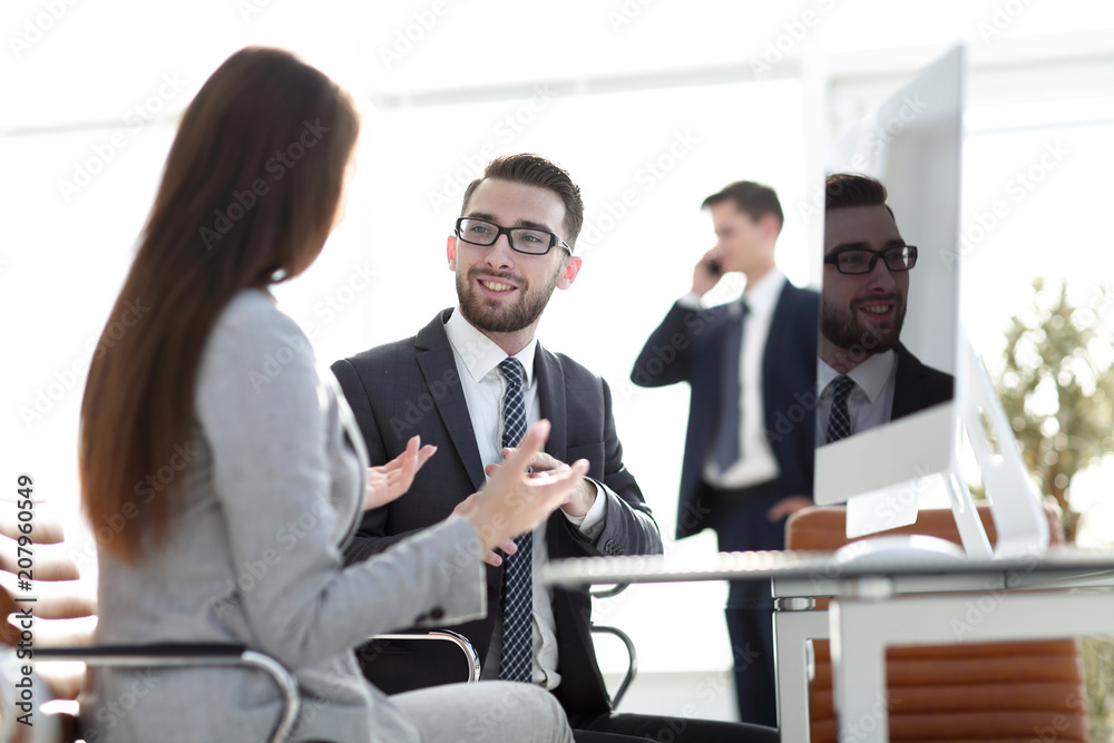 Confident man talking to his interviewer during a job interview Confident man talking to his interviewer during a job interview