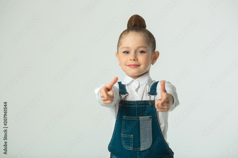 beautiful little smiling girl on a light background beautiful little smiling girl on a light background
