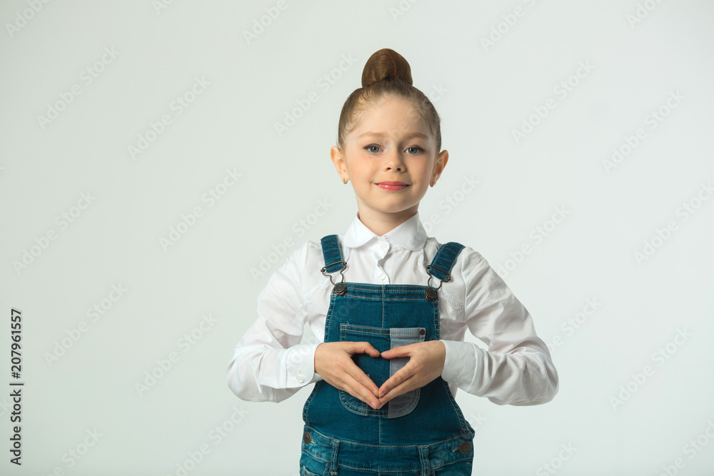 beautiful little smiling girl on a light background beautiful little smiling girl on a light background