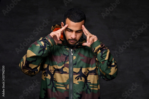 Handsome African-American guy wear military jacket.