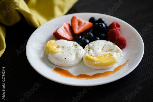 poached eggs and fruit breakfast