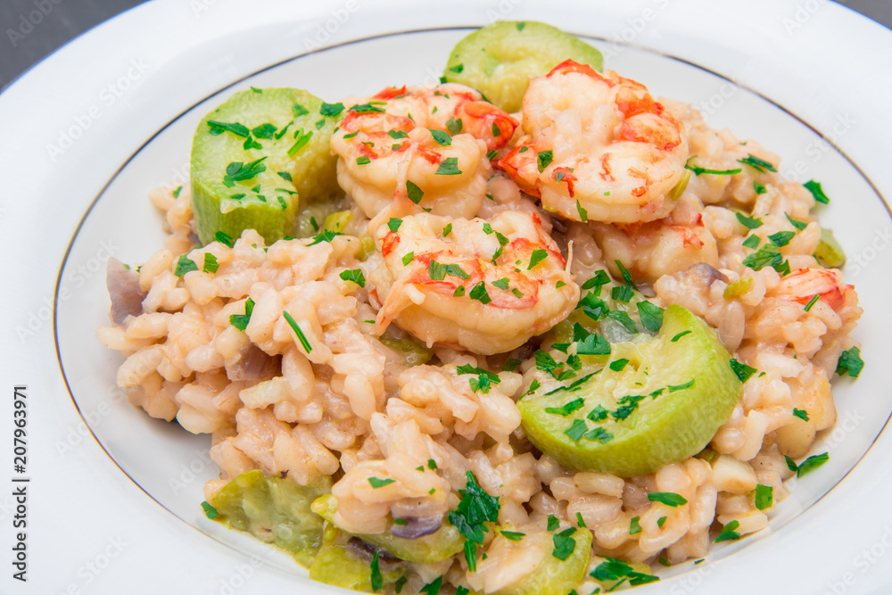 dish with risotto with prawns and zucchini