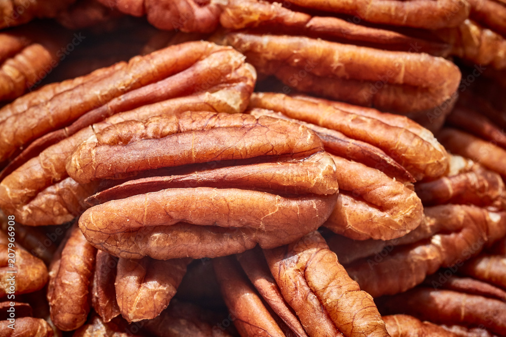 Close up picture of dried pecan nuts, selective focus. Close up picture of dried pecan nuts, selective focus.