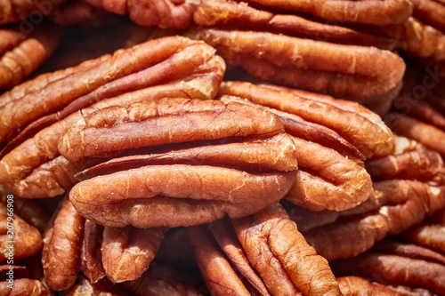 Close up picture of dried pecan nuts, selective focus.