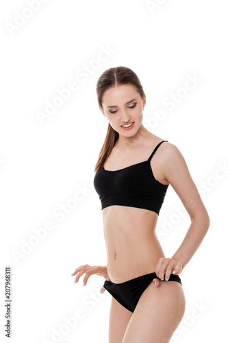 woman with perfect sporty body in black lingerie