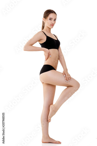 woman with perfect sporty body in black lingerie