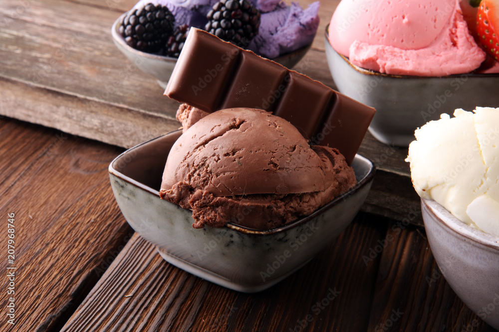 Set of ice cream scoops of different colors and flavours with berries, nuts and fruits Set of ice cream scoops of different colors and flavours with berries, nuts and fruits
