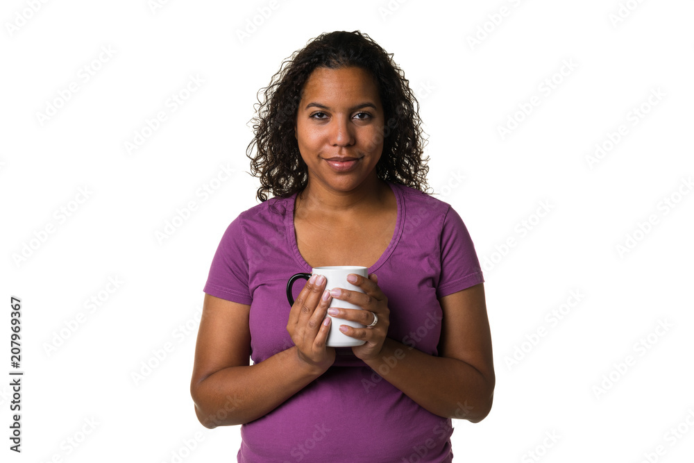 Young mixed race woman in purple shirt drinking a hot liquid from a black and white cup isolated with a white background Young mixed race woman in purple shirt drinking a hot liquid from a black and white cup isolated with a white background