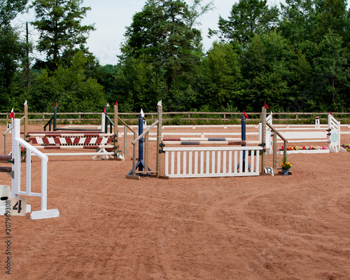 Horse Jumps set up in the Hunter show ring with trees in the background and no people or animals
