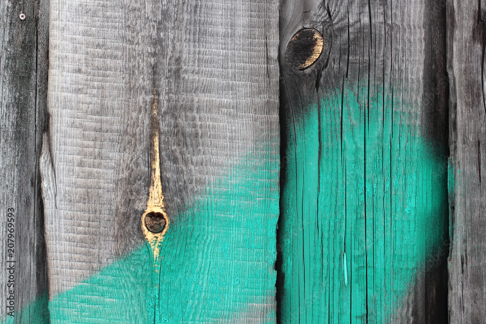 wooden fence with hole and green stripe wooden fence with hole and green stripe