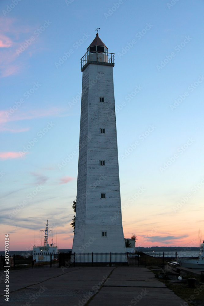 lighthouse on the waterfront of Krondshtat at sunset