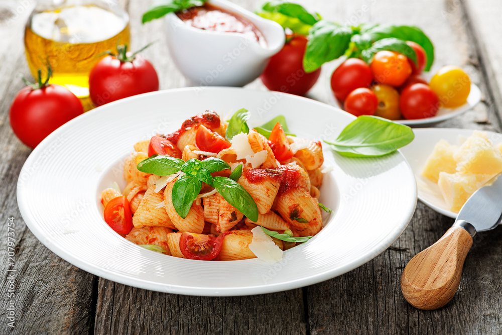 Pasta with spicy tomato sauce, parmesan and basil. Pasta with spicy tomato sauce, parmesan and basil.