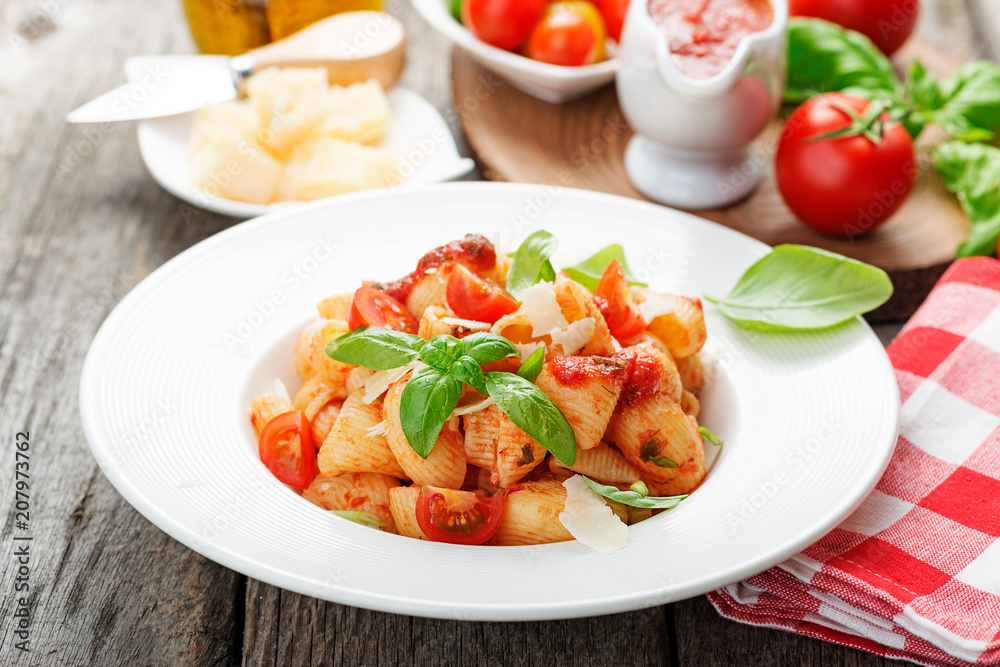 Pasta with spicy tomato sauce, parmesan and basil. Pasta with spicy tomato sauce, parmesan and basil.