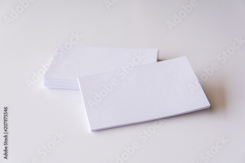 Stack of blank white business cards. Mockup business cards on white background