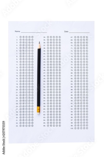 Standardized test form with answers bubbled in and a pencil isolated on white with clipping path photo