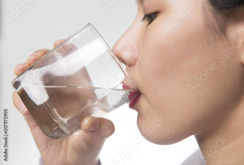 Young Asian woman drinking water