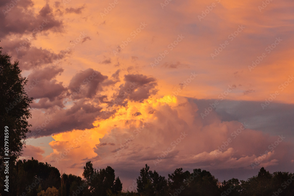 Orange summer sunset over a homestead in Montana. Orange summer sunset over a homestead in Montana.
