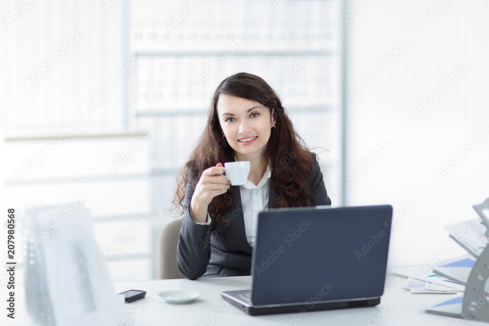 young business woman with Cup of coffee in a work break young business woman with Cup of coffee in a work break