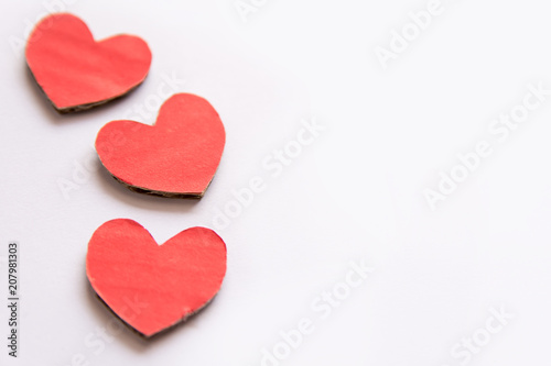 Red paper heart shape isolated on white with copy space