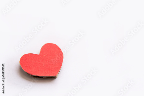 Red paper heart shape isolated on white with copy space