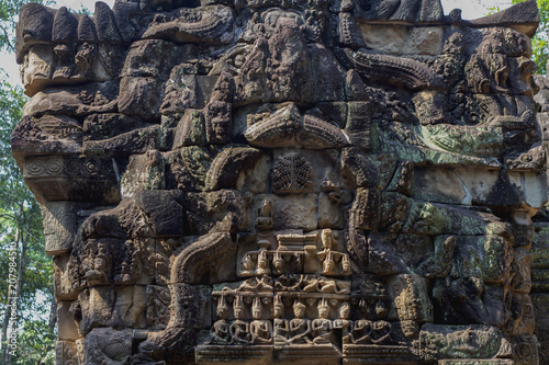 Ancient stone carving of Ta Prohm temple, Angkor Wat complex, Cambodia. Carved gate of temple ruin. © Elya.Q