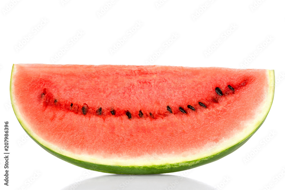 Sweet watermelon slice, front view, over white. Large ripe fruit of Citrullus lanatus with green striped skin, red pulp and black seeds. Edible, raw and organic. Food photo, closeup.